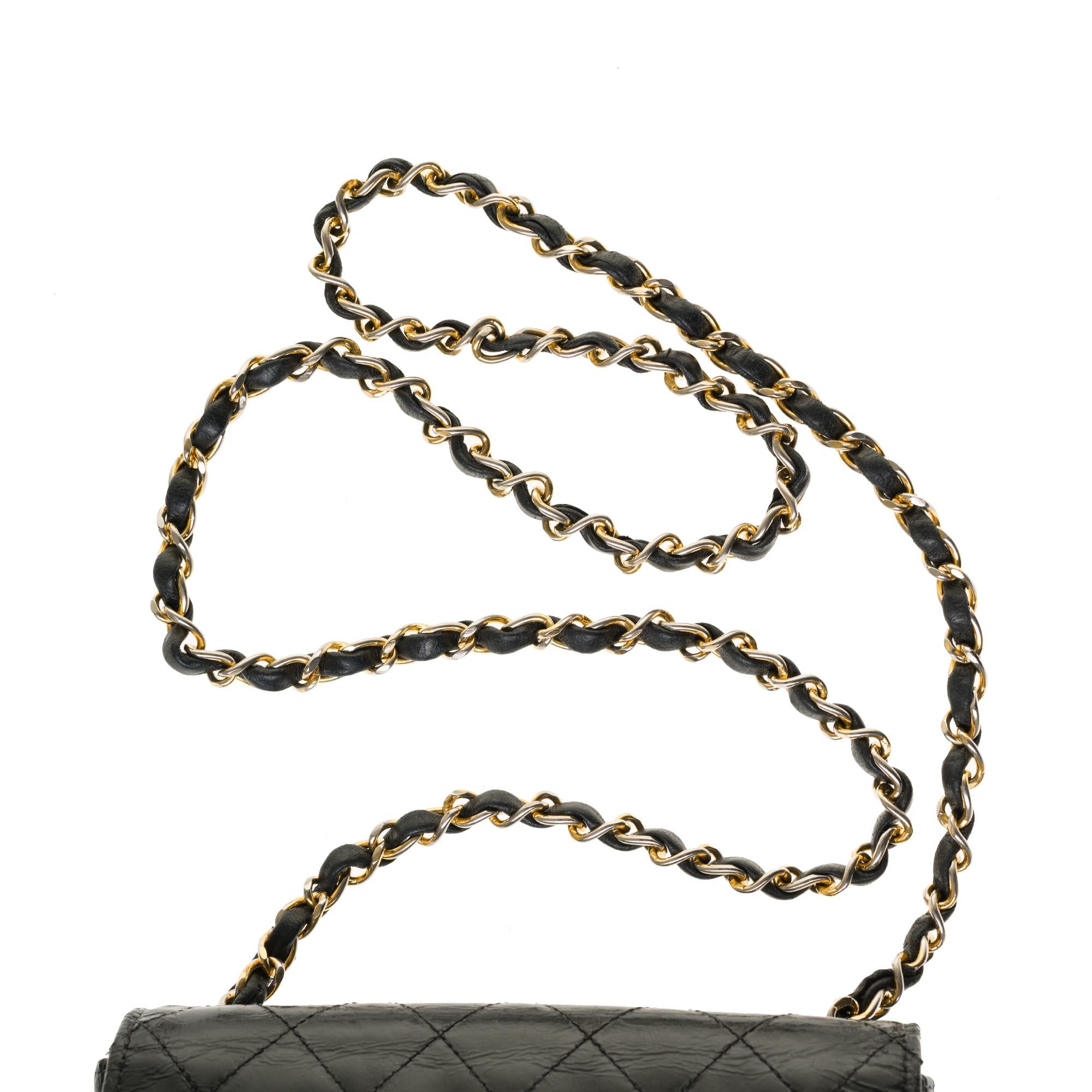 Women's Chanel Mini square handbag in black quilted patent leather, gold hardware