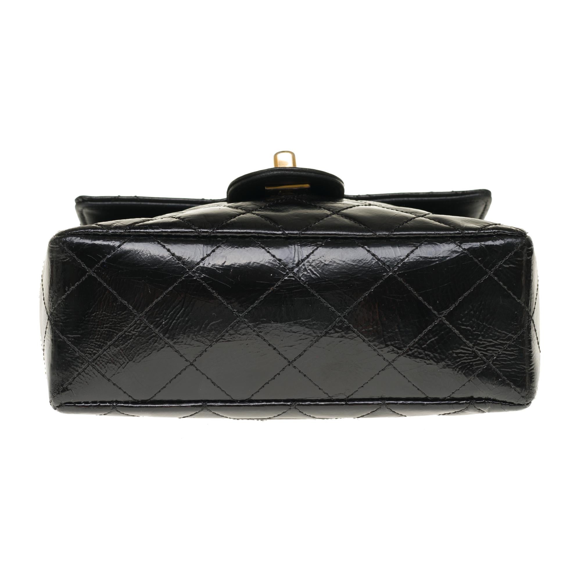 Chanel Mini square handbag in black quilted patent leather, gold hardware 1
