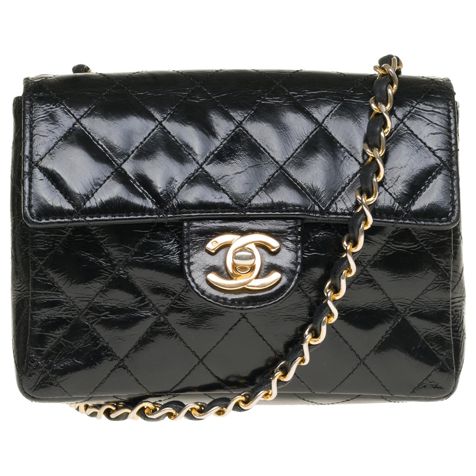 Chanel Mini square handbag in black quilted patent leather, gold hardware