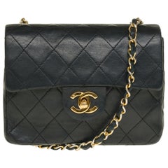 Chanel Mini Timeless handbag in black quilted lambskin,  gold hardware
