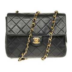 Chanel Mini Timeless in black quilted Lambskin shoulder bag with gold hardware
