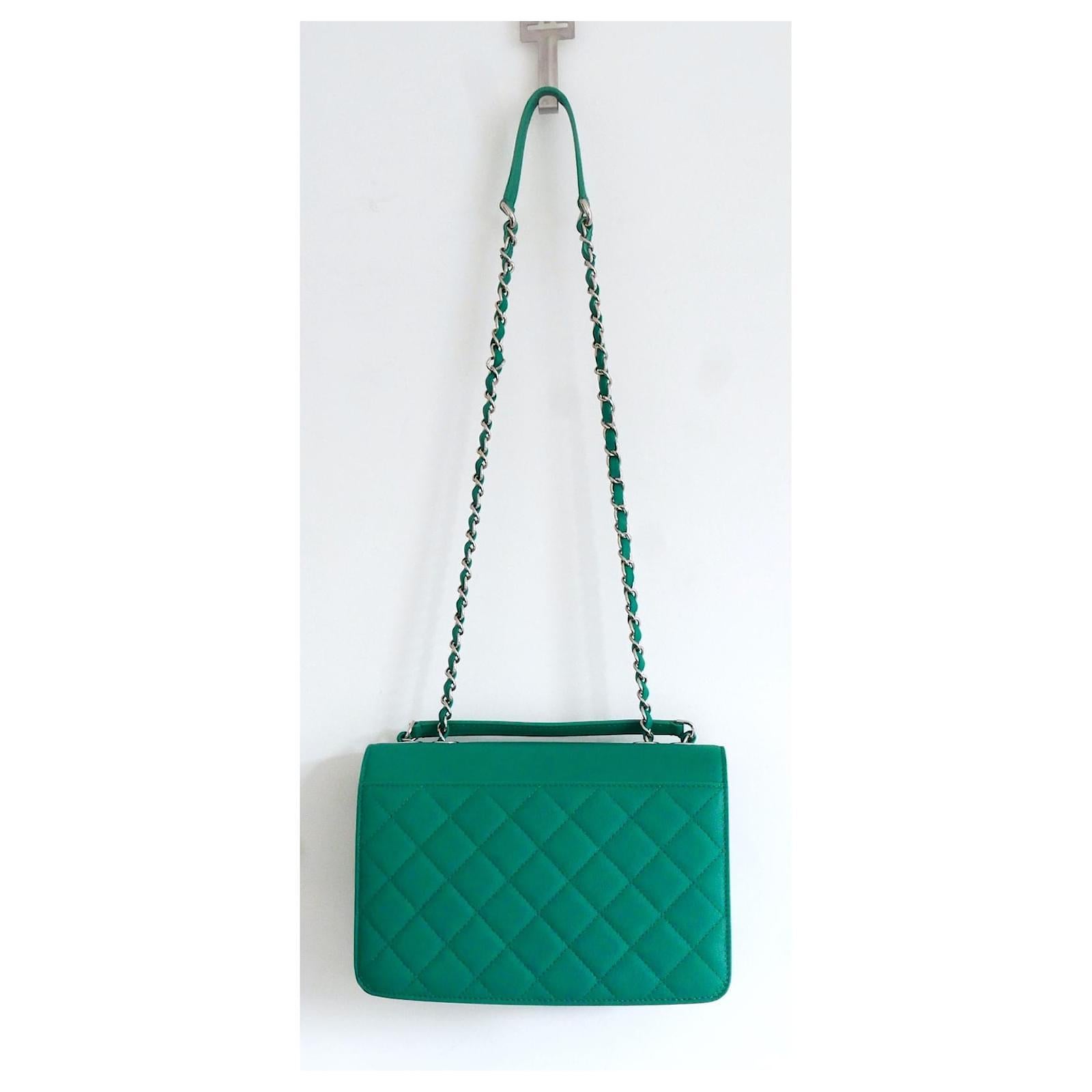 Absolutely stunning Chanel Mini Urban Companion Flap Bag. Unworn with dustbag and authenticity card. Made from bright emerald green grained calf leather with half covered silvertone CC clasp. It has roomy quilted front pocket, concertina sides and