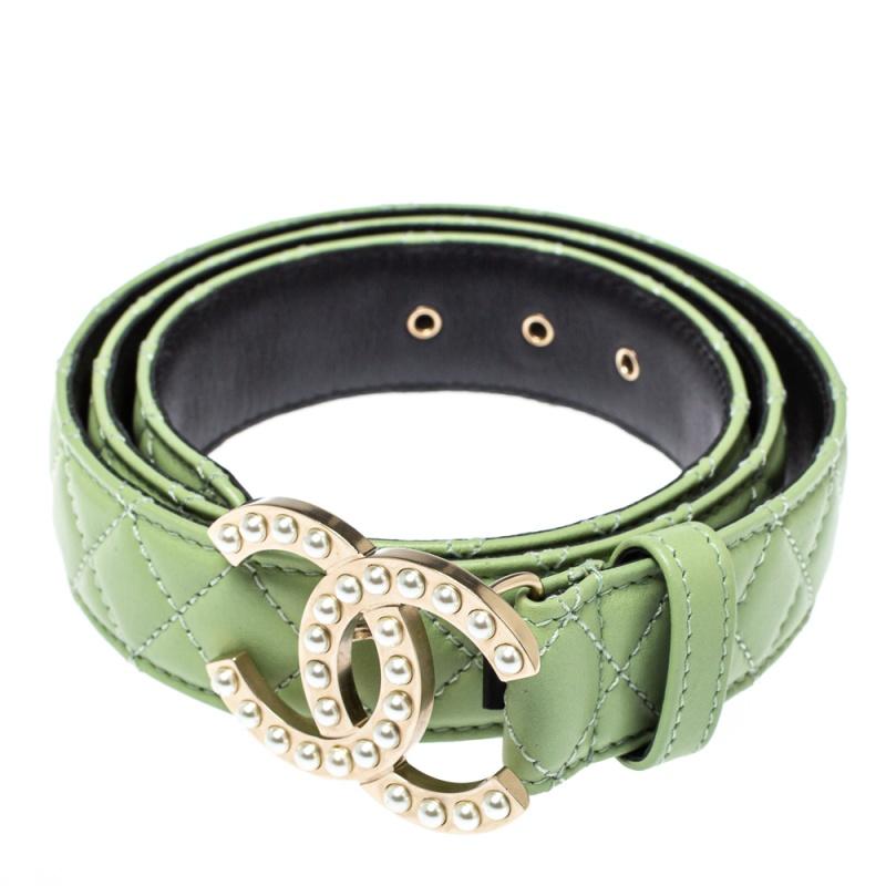 This stylish and timeless belt from the house of Chanel will add grace to your attire with its elegant appeal. The belt is crafted from quilted leather in a mint green hue and features a gold-tone, pearl-embellished CC logo