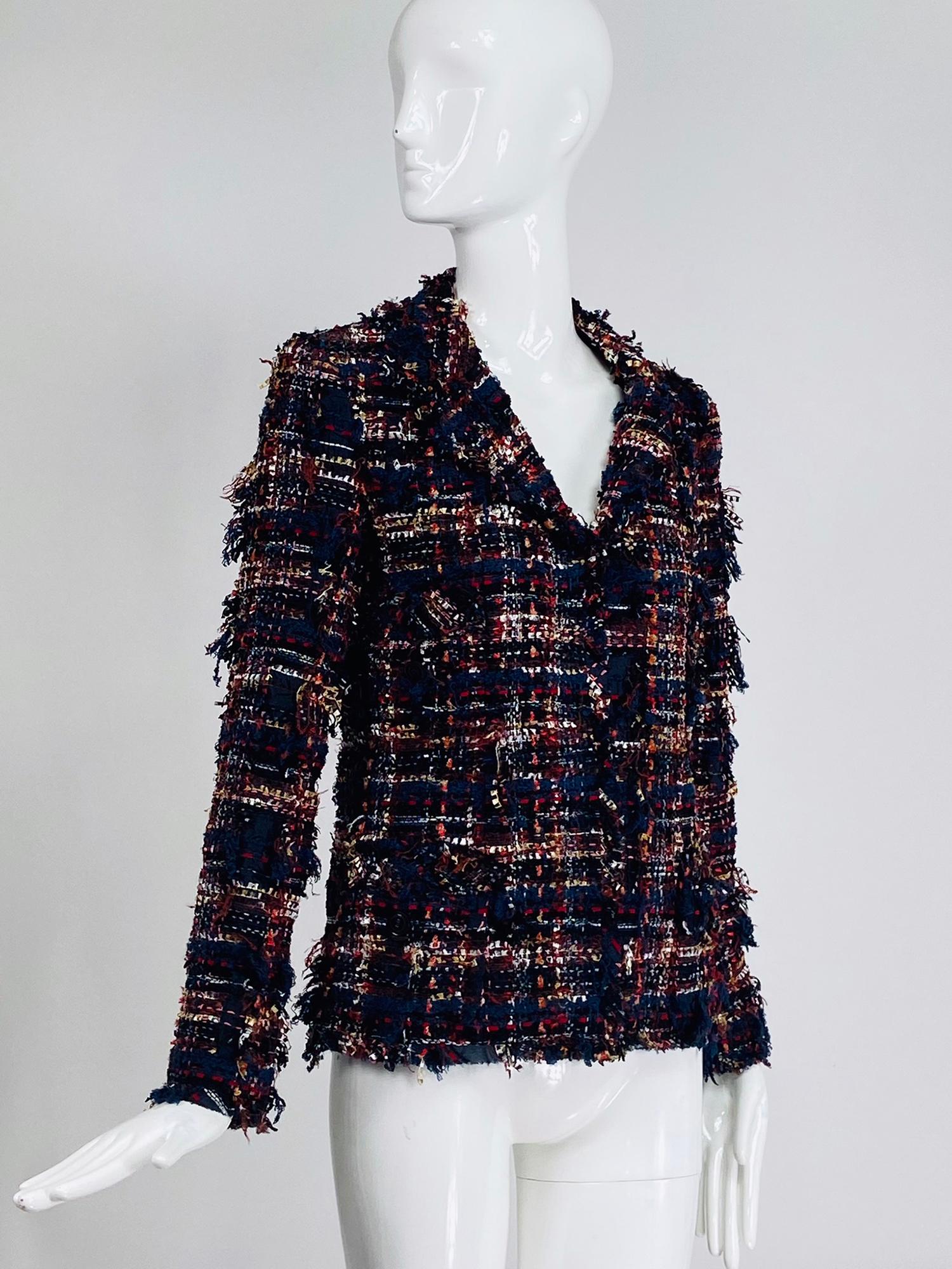 Chanel mix thread single breasted tweed jacket 07A. This interesting irregular tweed has lots of texture woven with ribbon, boucle thread, tassel thread, wool and lots more in colours of, white, red, orange black, coral and more. 4 pocket jacket,