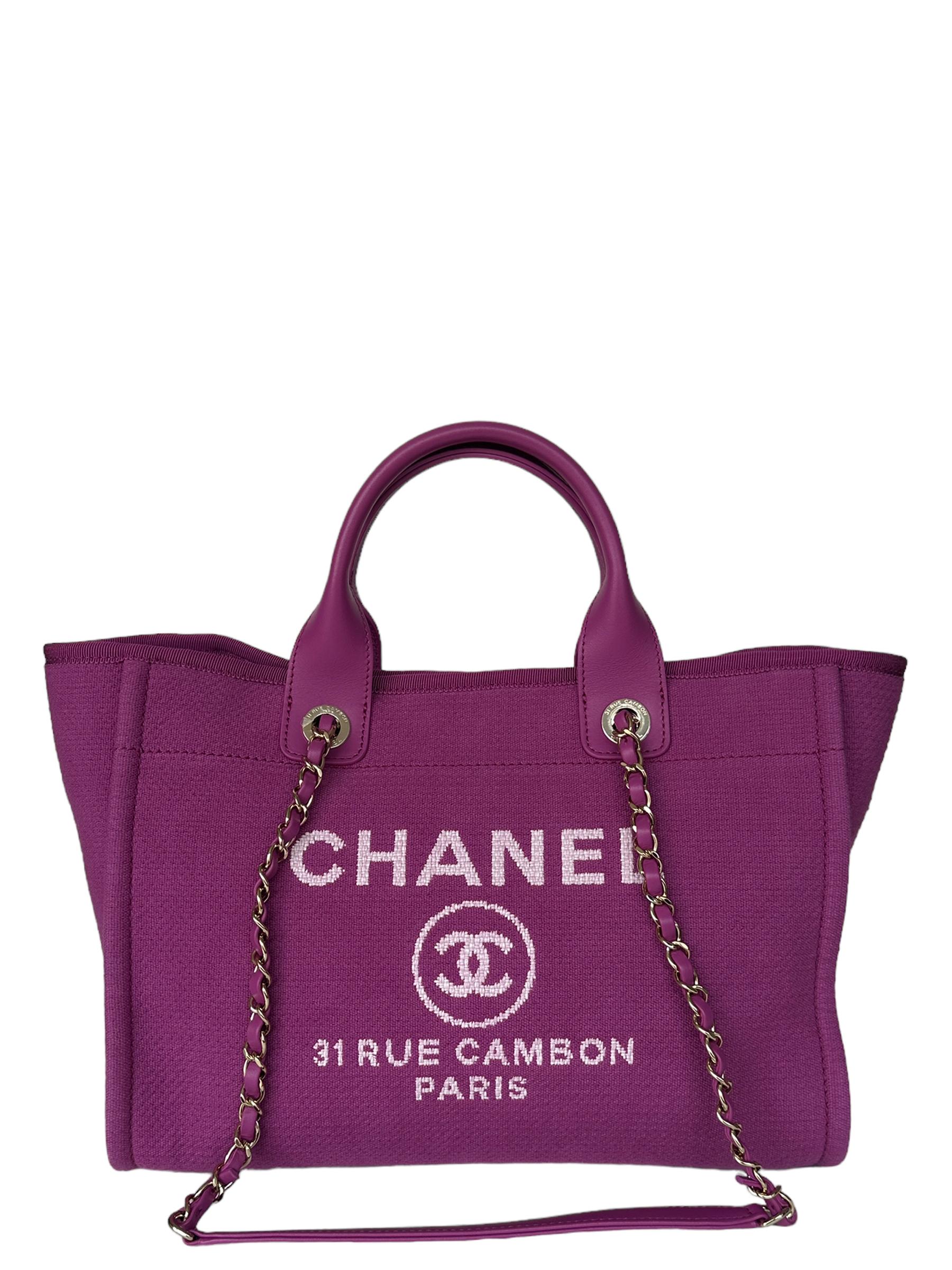 Chanel Magenta Mixed Fibers Small Deauville Tote Bag.  Features magenta purple leather handles and leather laced pale goldtone chain straps.

Made In: Italy
Year of Production: 2022-2023
Color: Magenta purple
Hardware: Pale goldtone
Materials: Mixed