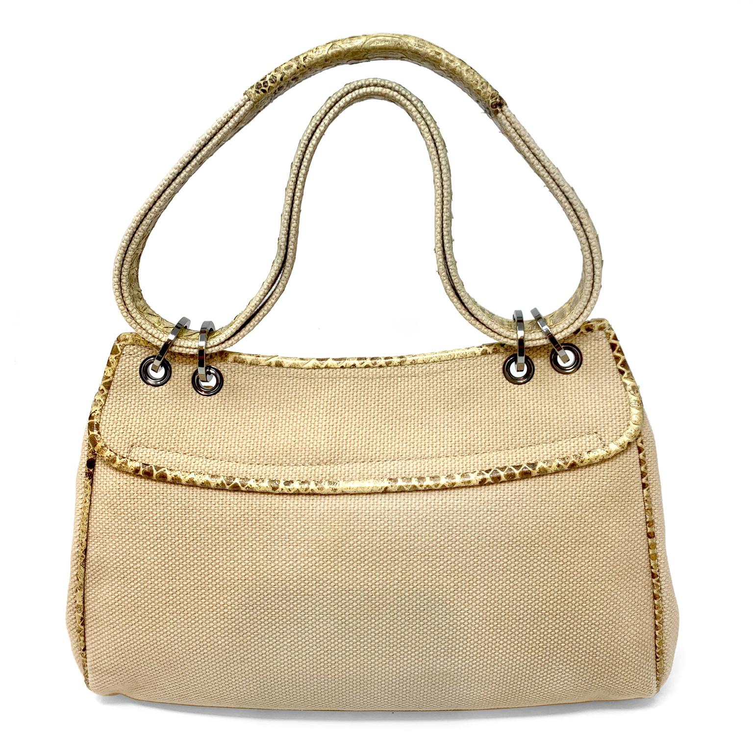 This authentic Chanel Mixed Media Snakeskin Bag is in very good condition overall.  Neutral snakeskin large front flap bag has silver interlocking CC closure.  Sides, bottom and rear panel in textured beige canvas with snakeskin trim.  Clean beige