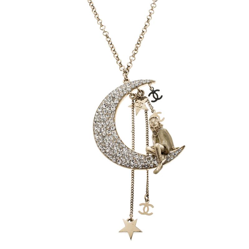 Accessorize that off-shoulder top of yours with this stunning necklace from Chanel. It is crafted from gold-tone metal and features a moon motif that is embellished with crystals along with stars and the iconic CC logos. This tassel pendant necklace