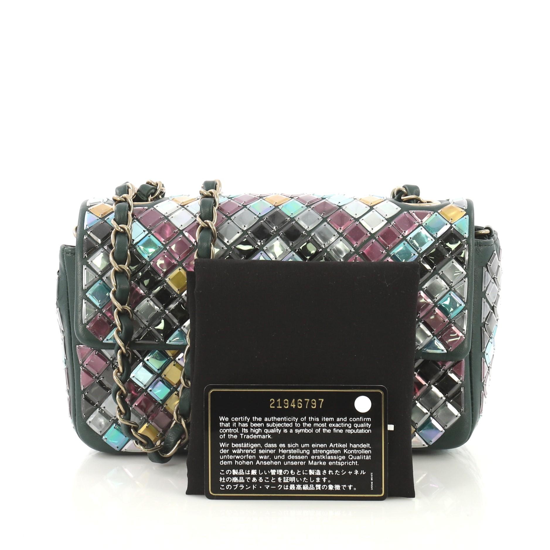 This Chanel Mosaic Flap Bag Embellished Lambskin Small, crafted in green multicolored embellished lambskin leather, features woven-in leather chain strap and gold-tone hardware. Its CC turn-lock closure opens to a green leather interior with zip and