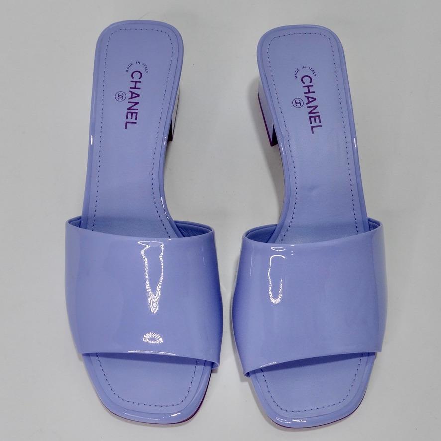 Calling all Chanel lovers! Do not miss out on these mesmerizing brand new 2022 Chanel mules in the most perfect periwinkle purple color! Classic slip-on mule style heels made from a shiny patent calfskin leather is beautifully complimented by dark