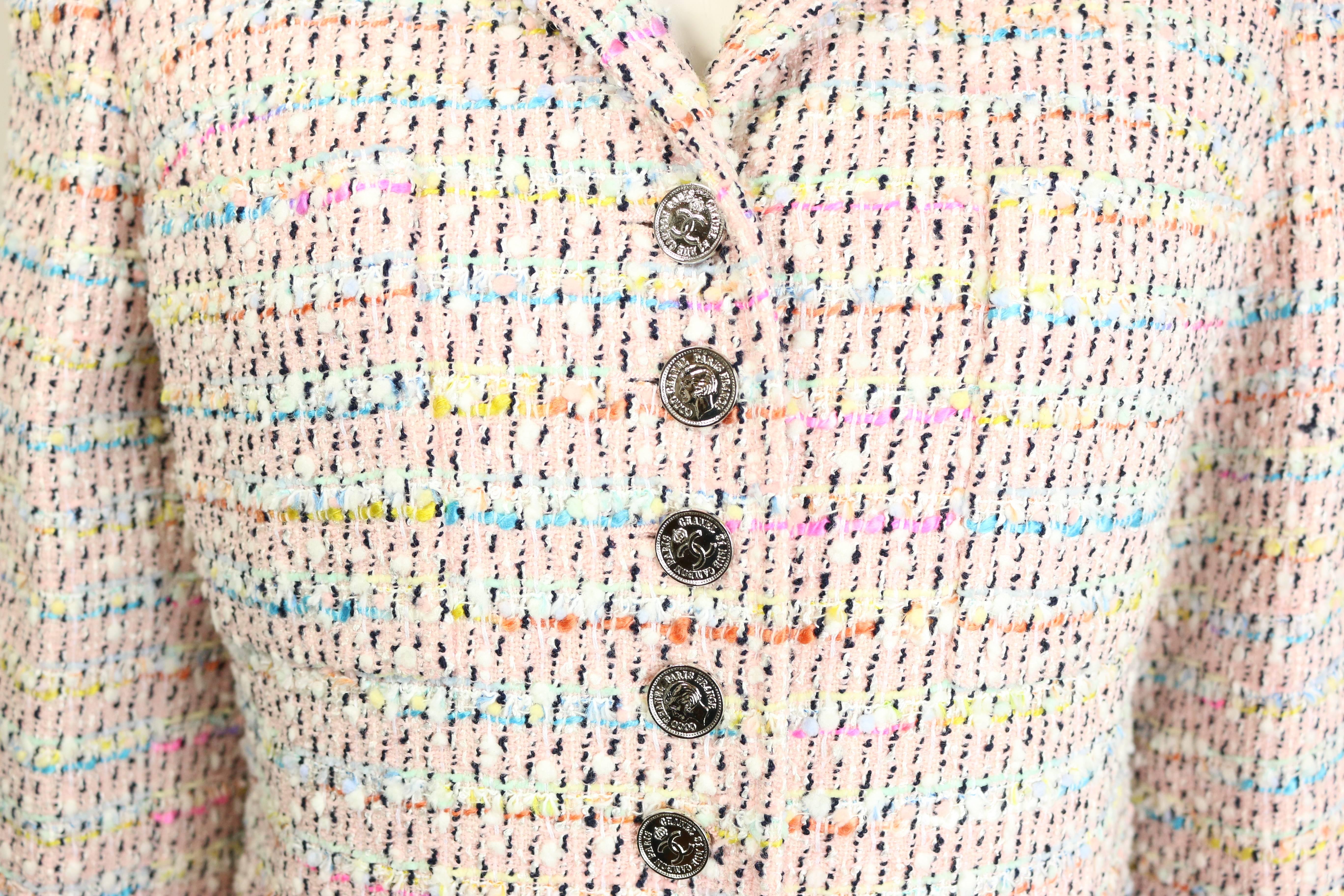 - Chanel multi-coloured tweed jacket from 1996 spring/summer collection. The use of colours is subtle and elegant with a modern touch! This tweed jacket is meant to last for decades! 


- Featuring thirteen closing front buttons and four buttons on