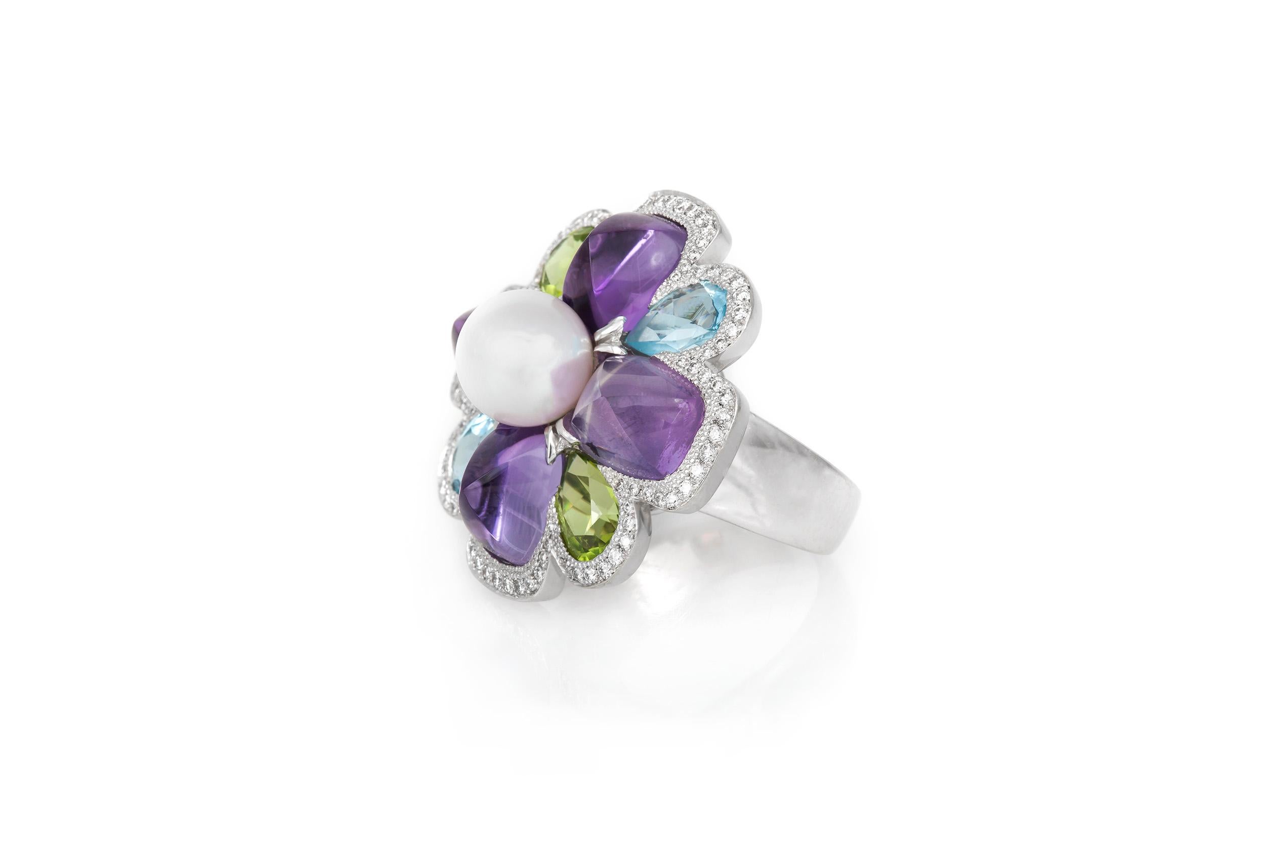 Colorful and Vibrant Chanel ring composed of peridot, amethyst, and aqua 