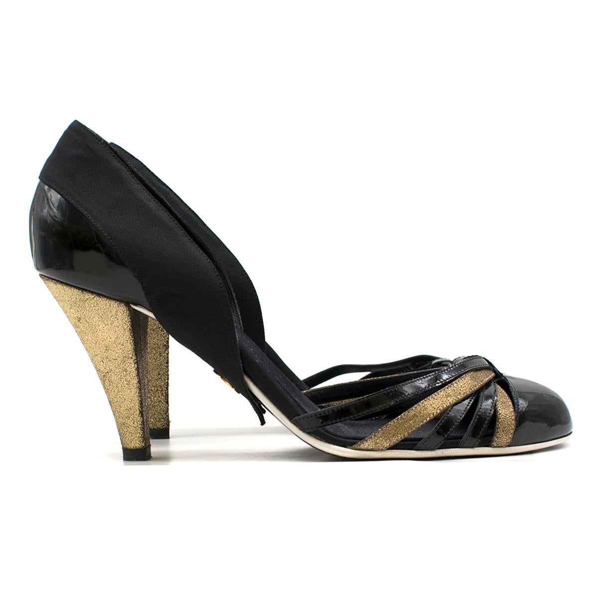 Chanel multi-strap patent leather pumps

- Black, patent leather 
- Almond toe, gold crackle-effect leather covered high heel 
- Black patent leather and gold crackle-effect leather multi-strap front feature 
- Black grosgrain heel feature 
- Black