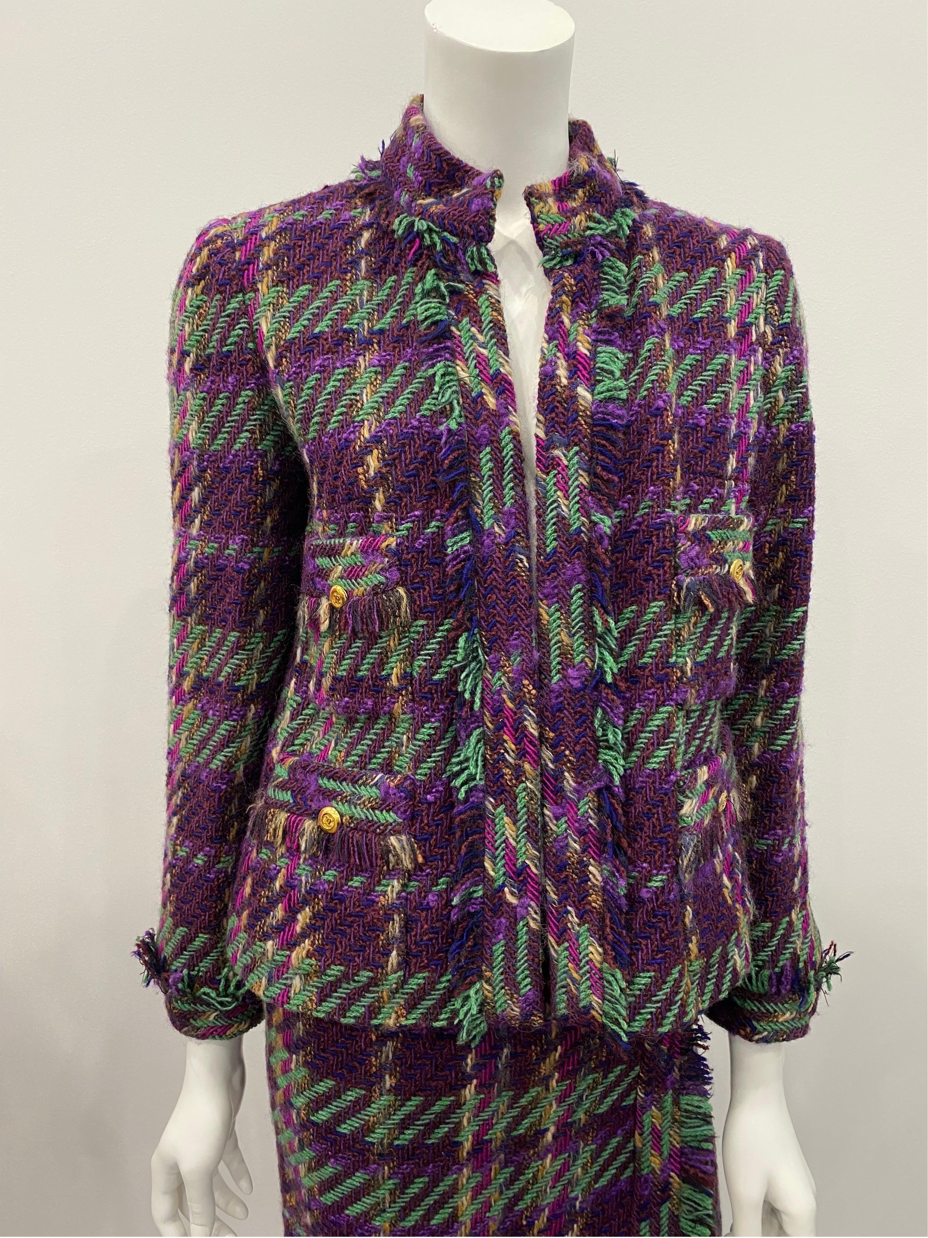 Chanel 1990's Multi Wool Tweed Skirt Suit - Sz 38  This gorgeous vintage jacket has fringe all around the trim of the jacket, there are 4 front patch packets with 4 gold buttons, each sleeve has a cuff with fringe trim with one gold button as well.