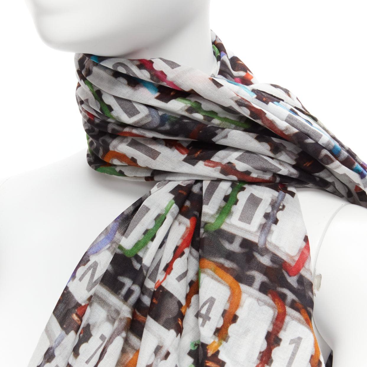 CHANEL multicolor 100% cotton CC logo data centre number print scarf
Reference: KEDG/A00262
Brand: Chanel
Designer: Karl Lagerfeld
Material: Cotton
Color: Multicolour
Pattern: Photographic Print
Made in: Italy

CONDITION:
Condition: Excellent, this