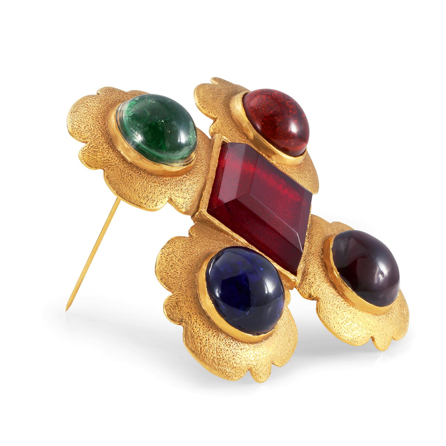 This authentic Chanel Multi Color Cabochon Gripoix Brooch is in excellent vintage condition from the mid to late 1980’s.  Hammered gold Maltese cross is adorned with Gripoix glass jewels in red, green and indigo.  Numbered on the back. 