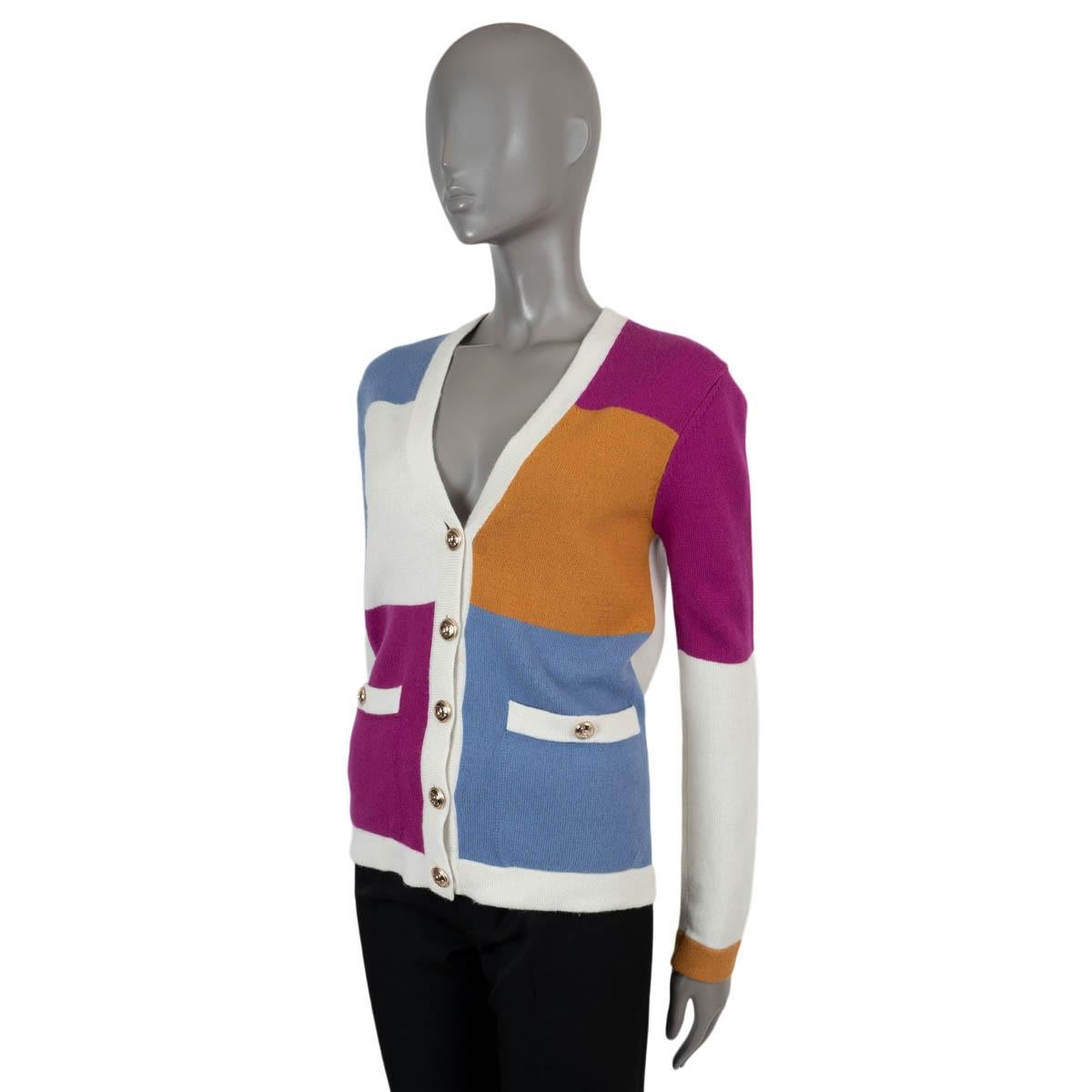 100% authentic Chanel colorblock cardigan in cream,pink, blue and camel cashmere (100%). Features rib-knit V-neck, hem and cuffs and two buttoned patch pockets. Closes with gold-tone CC buttons. Unlined. Has been worn and is in excellent condition.