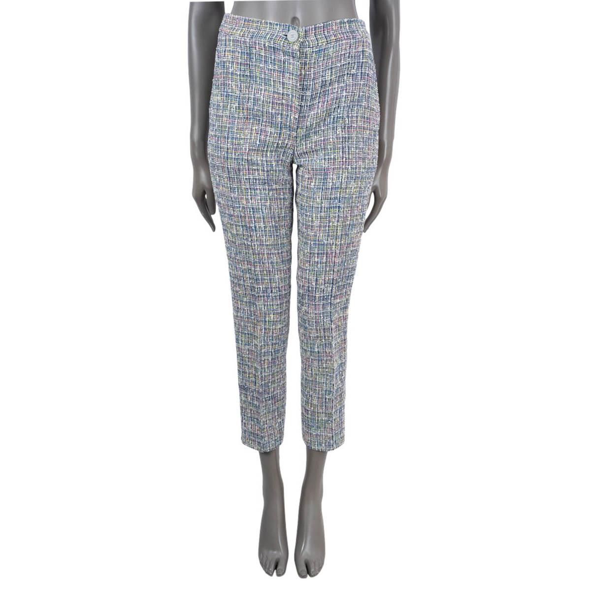 100% authentic Chanel tweed pants in blue, yellow, green, pink, off-white and blue acrylic (53%), cotton (31%), nylon (10%) and polyester (6%). Features a cropped, straight-leg and two slit pockets. Closes with a CC button and concealed zip. Lined