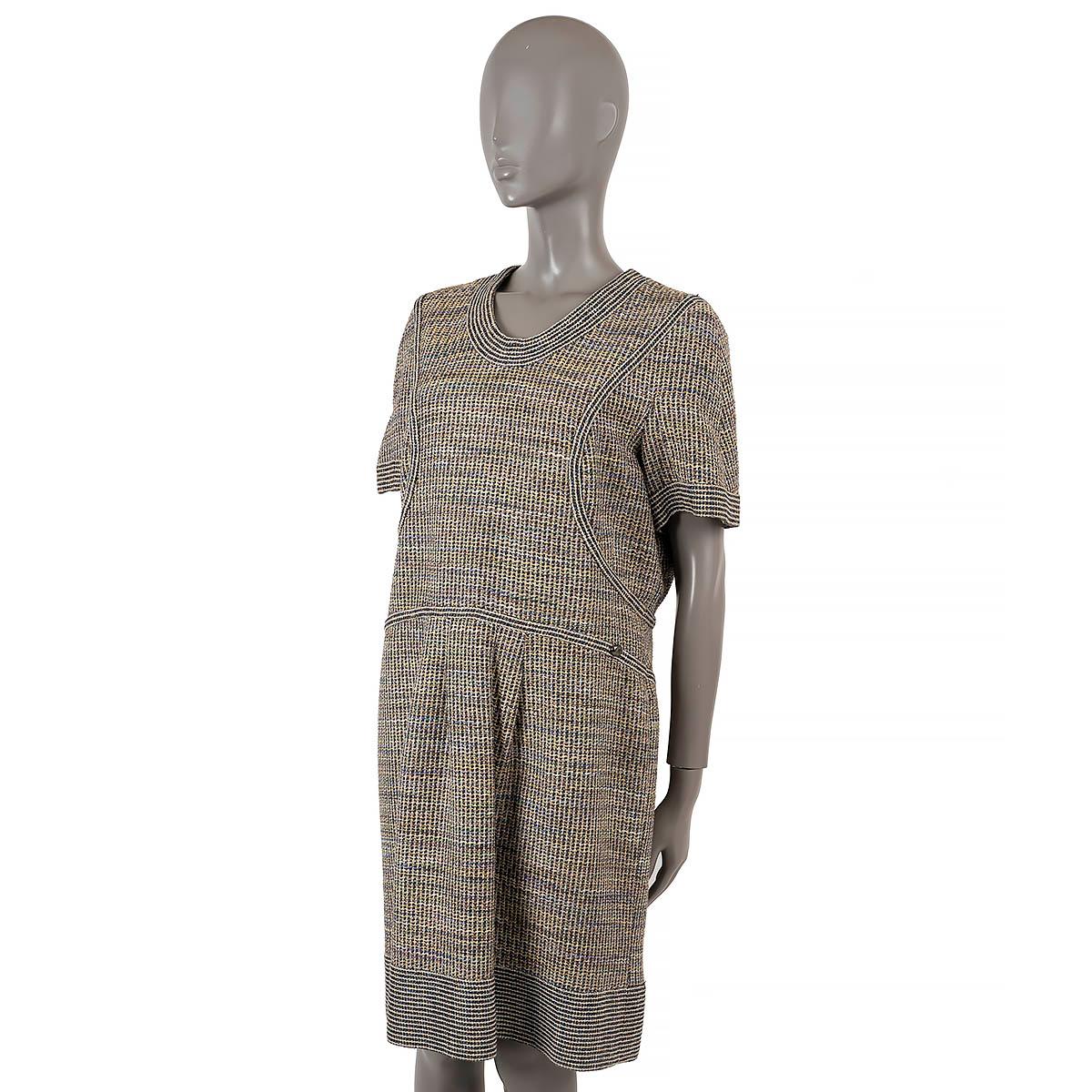 100% authentic Chanel tweed sheath dress black and white acrylic (44%), cotton (43%), acetate (10%), polyester (1%), polyamide (1%)and polyester (1%) with multicolor color and blue lurex details. Features short sleeves, box pleated skirt, striped