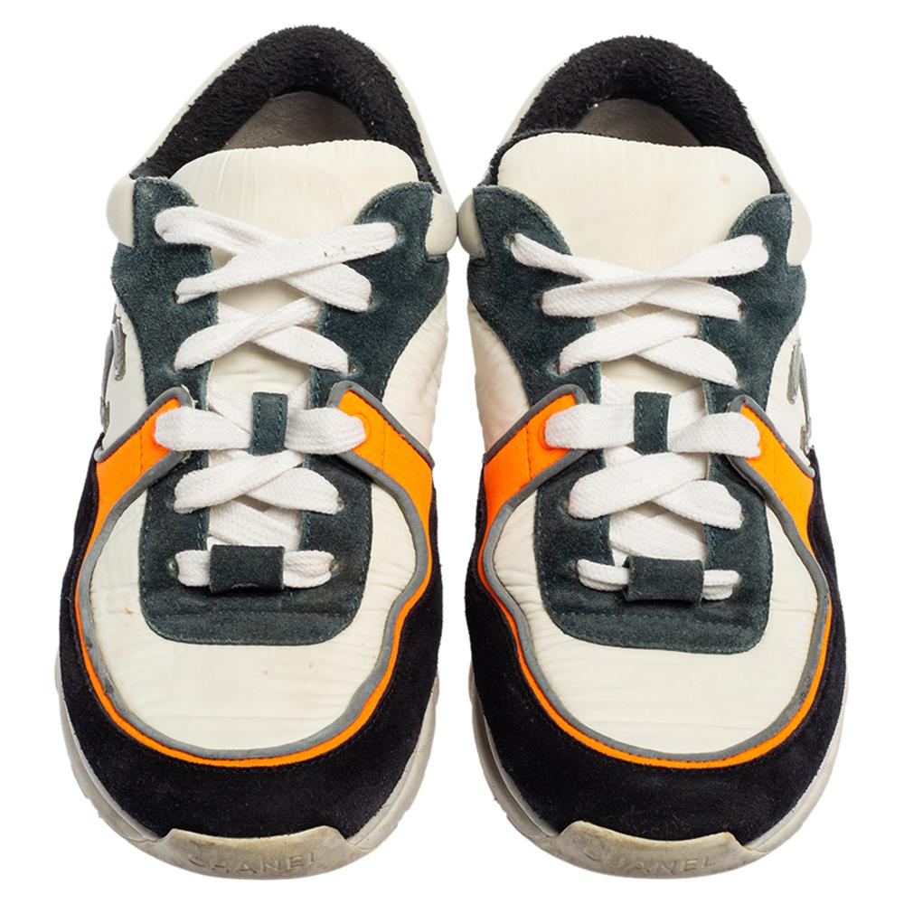 Fashioned to elevate your style a notch higher, these impeccable sneakers from Chanel are absolutely worth the splurge! They are created using multicolored fabric and suede on the exterior, granting them a colorful look. They show lace-up details,