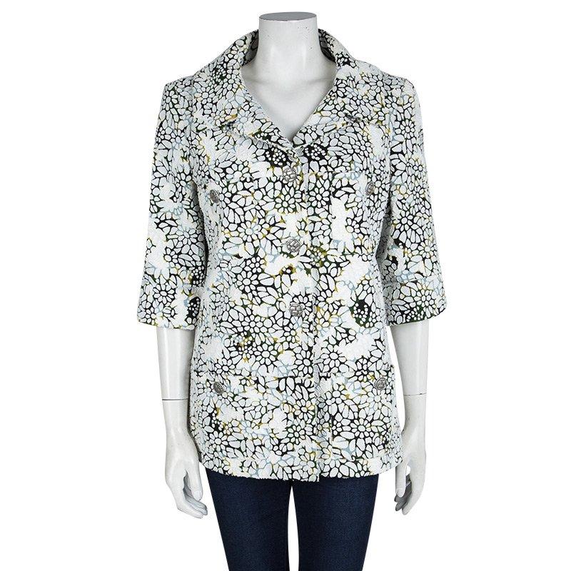 Jackets like this one by Chanel boasts of excellent craftsmanship and high style. It has been crafted from cotton and styled with floral appliques, buttons and mid-sleeves. You're sure to silence the crowd when you step out wearing this unique