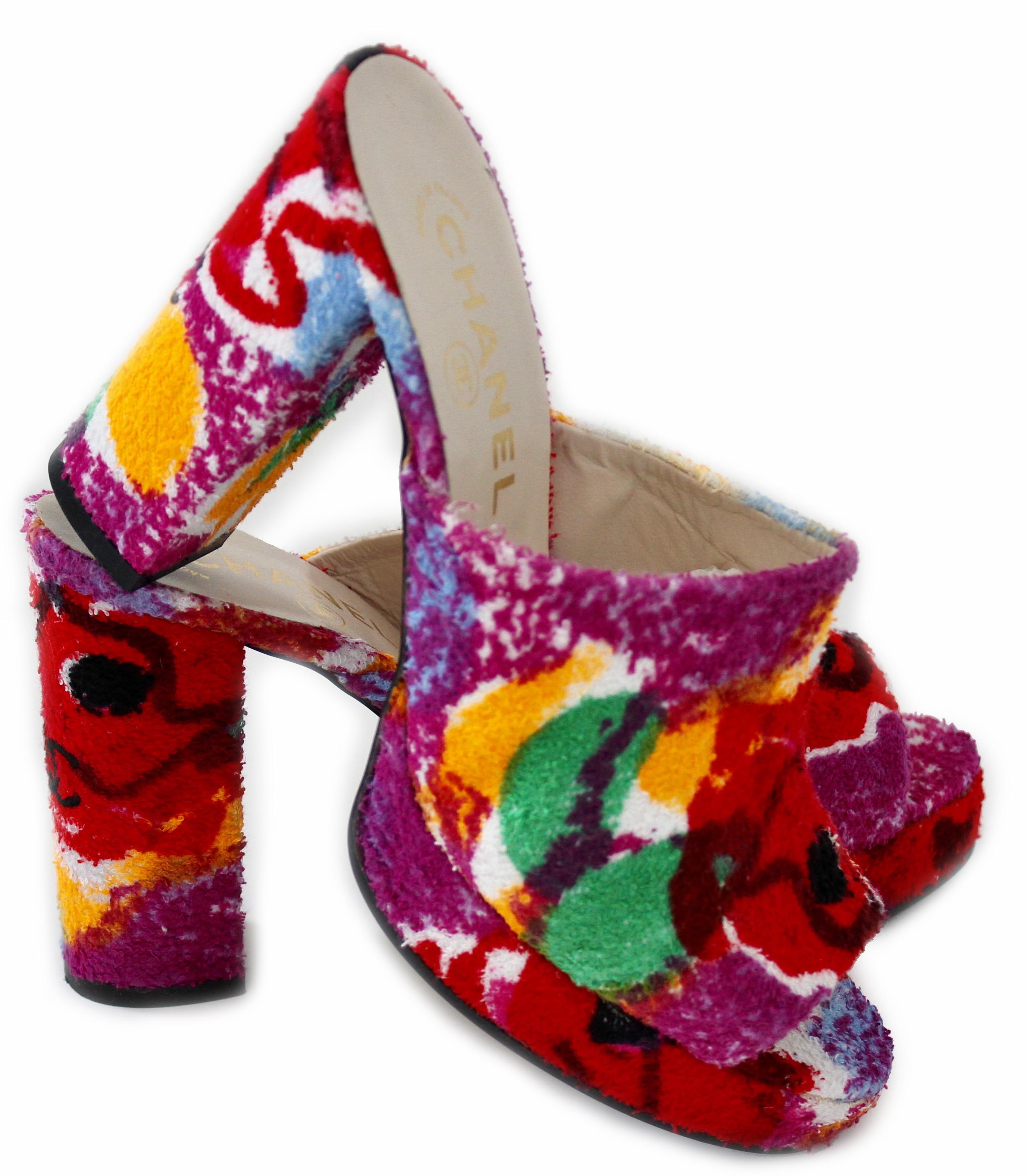 Here's a fabulous pair of platform heels from Chanel, most likely made in the 1990s.  Made from a vibrant floral terry cloth fabric, they feature 4.25in H block heels with leather uppers and soles.  Note that these are new old stock, never worn and