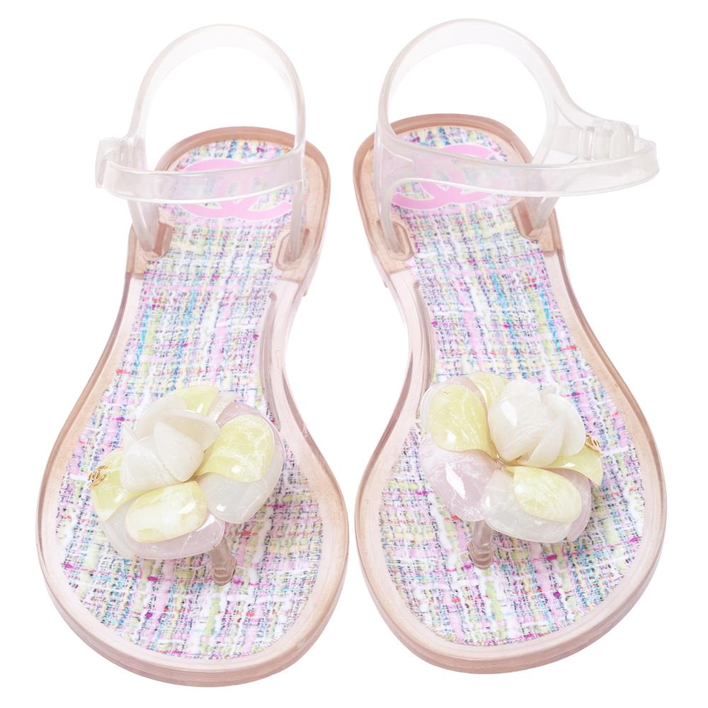 A pretty pair of flat sandals from the house of Chanel! They've been crafted from jelly which makes them water-friendly whilst providing soft comfort to your feet. The pair features buckle fastenings and a Camellia acts as the toe keeper. You can