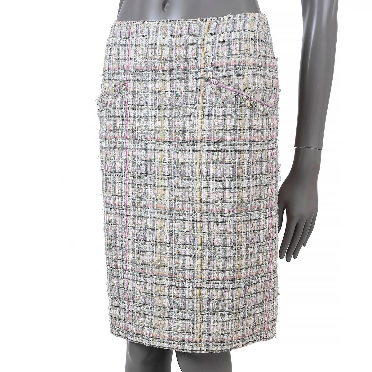 100% authentic Chanel tweed skirt in various shades of green and pink viscose (34%), nylon (25%), acetate (10%), acrylic (10%), polyester (8%), silk (5%), wool (5%) and vinyon (3%). Features clover sequins through-out, two fringe trimmed slit