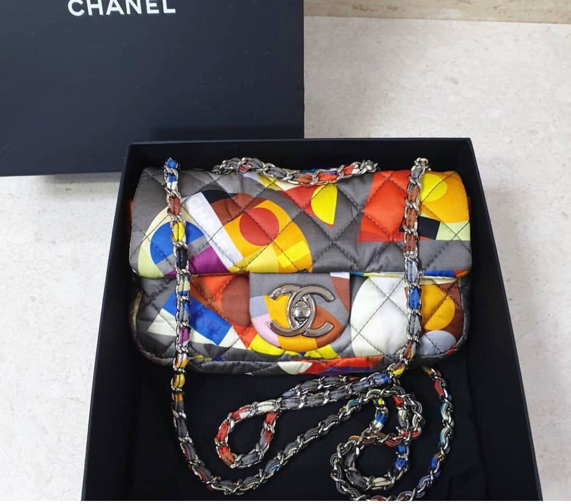 CHANEL

Multicolor Printed Nylon Flap Bag



From the Fall 2014 runway collection

The exterior is clean and beautiful. The hardware is bright and shiny with hairline surface scratches to the CC. The interior lining is clean with some light staining
