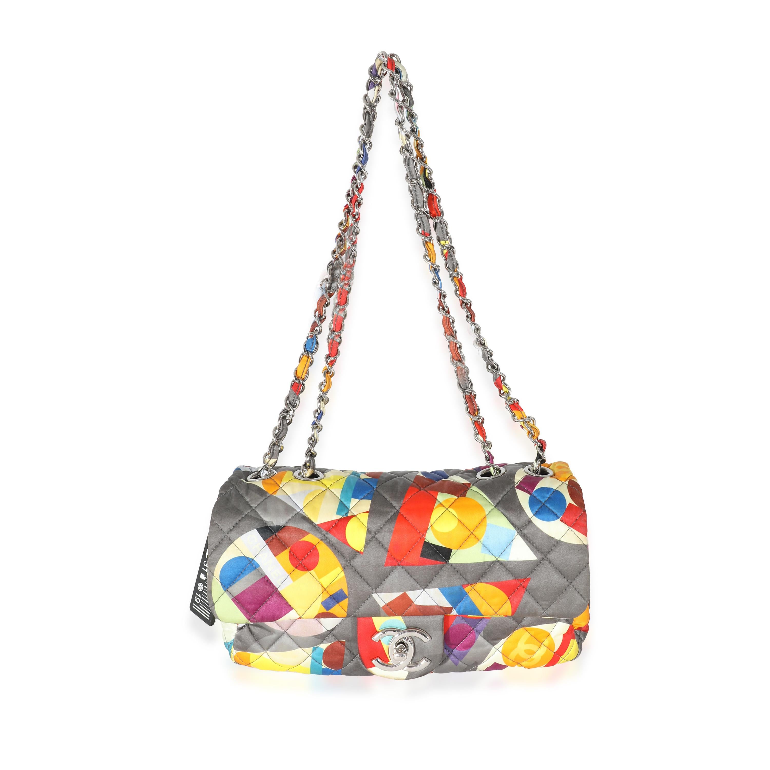 Listing Title: Chanel Multicolor Printed Nylon Medium Coco Color Flap Bag
SKU: 133686
Condition: Pre-owned 
Condition Description: A timeless classic that never goes out of style, the flap bag from Chanel dates back to 1955 and has seen a number of