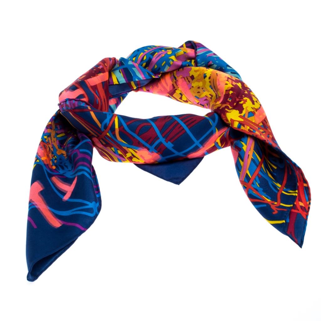 Keep yourself snug with this awesome piece of scarf from the house of Chanel. Complete your daily ensemble with this splendid multi-colored scarf. This silk blend scarf is just perfect for layering on any occasion with any outfit of your
