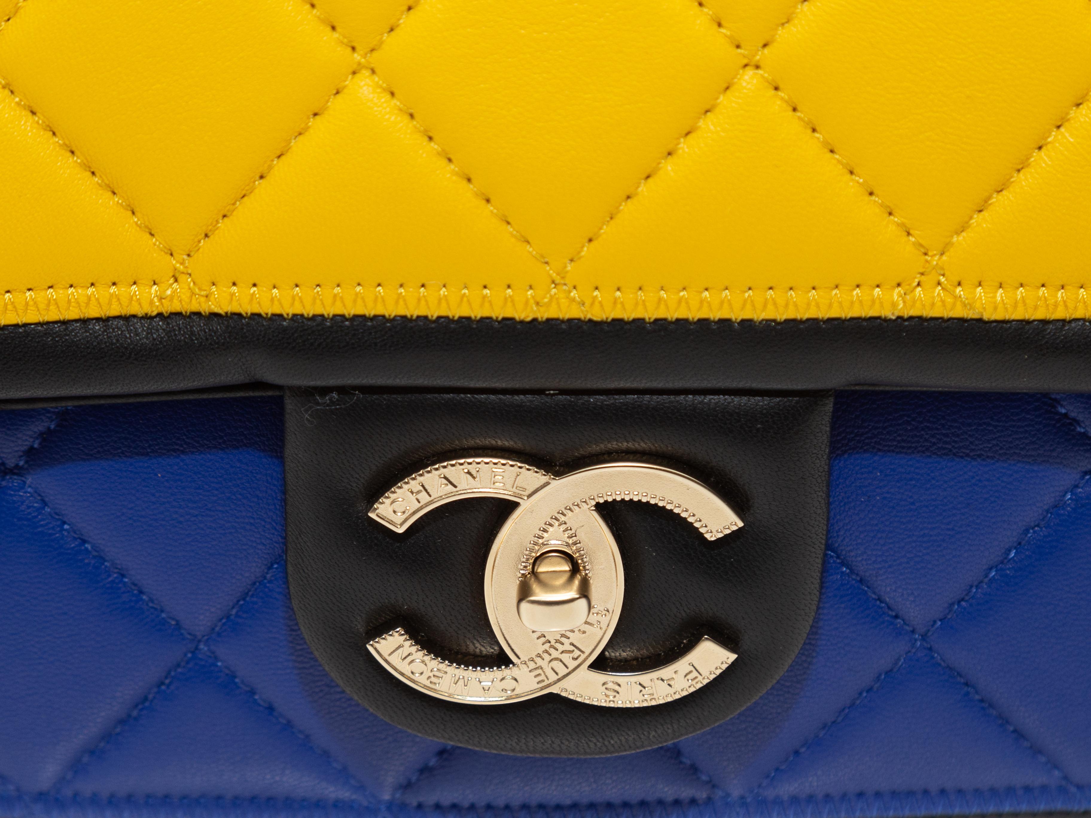 Product details: Multicolor quilted leather color block Medium Flap Bag by Chanel. Gold-tone hardware. Interior zip pocket. Chain-link and leather strap. CC push-lock closure at front flap. 10.5