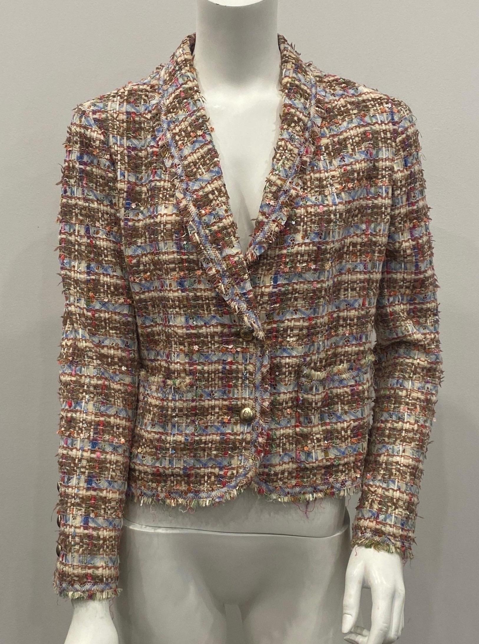 Chanel Multicolor Ribbon Boucle Jacket -Size 40 - 2005P The fabric of this jacket is a boucle made up of multi color and size ribbons woven throughout with tiny multi color flower shaped sequins to give it that final touch. Very classic of the