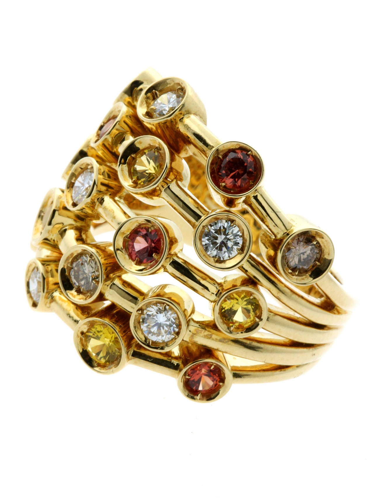 A magnificent authentic Chanel cocktail ring featuring  a brilliant assortment of multicolored fancy sapphires and both white & fancy brown diamonds set in 18k yellow gold.

Size:  53 / US 6 1/4
Dimensions: 20mm wide (.78″ Inches)

Inventory ID: