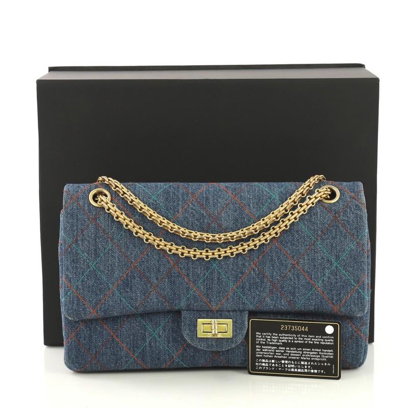 This Chanel Multicolor Stitch Reissue 2.55 Flap Bag Quilted Denim 226, crafted from blue quilted denim, features reissue chain link strap, exterior back slip pocket, and matte gold-tone hardware. Its mademoiselle turn-lock closure opens to a blue