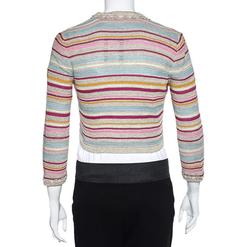 Created through careful construction, this Chanel cropped cardigan for women promises classic style and quality! It is knit using quality materials and it features multicolor stripes, front button closure, and two pockets.

