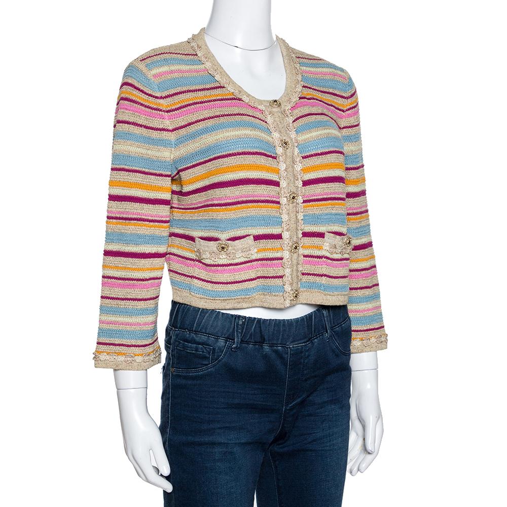 This gorgeous cardigan by Chanel comes in lovely shades. It is crafted from a cotton blend and is extremely comfortable. This casual creation features gold-tone buttons, front pockets and stripe patterns throughout. It can elevate a simple outfit