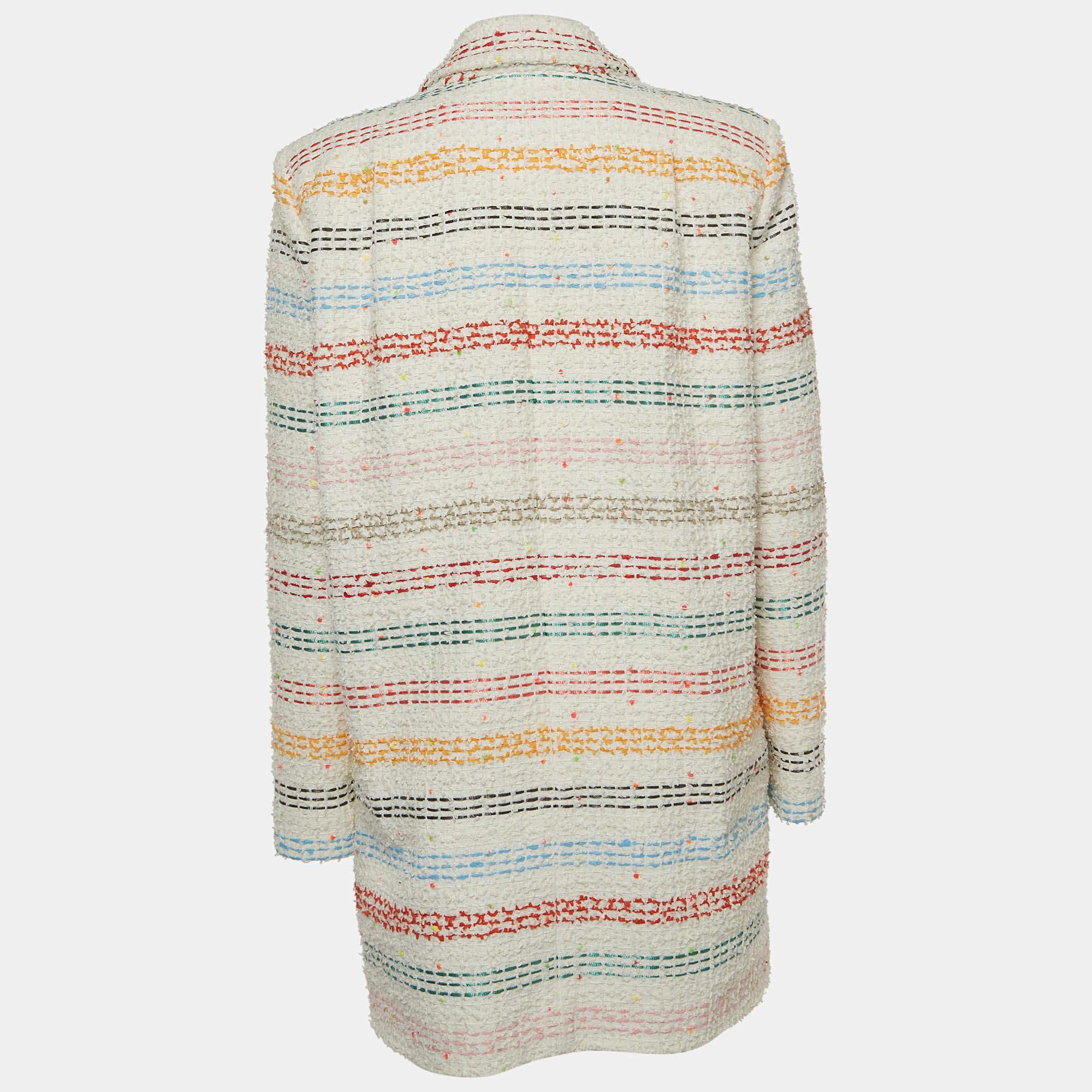 The Chanel jacket is a luxurious fashion statement. Crafted from high-quality tweed fabric, it features multicolor stripe design and two external pockets. With its iconic Chanel design, this jacket exudes elegance and sophistication.

