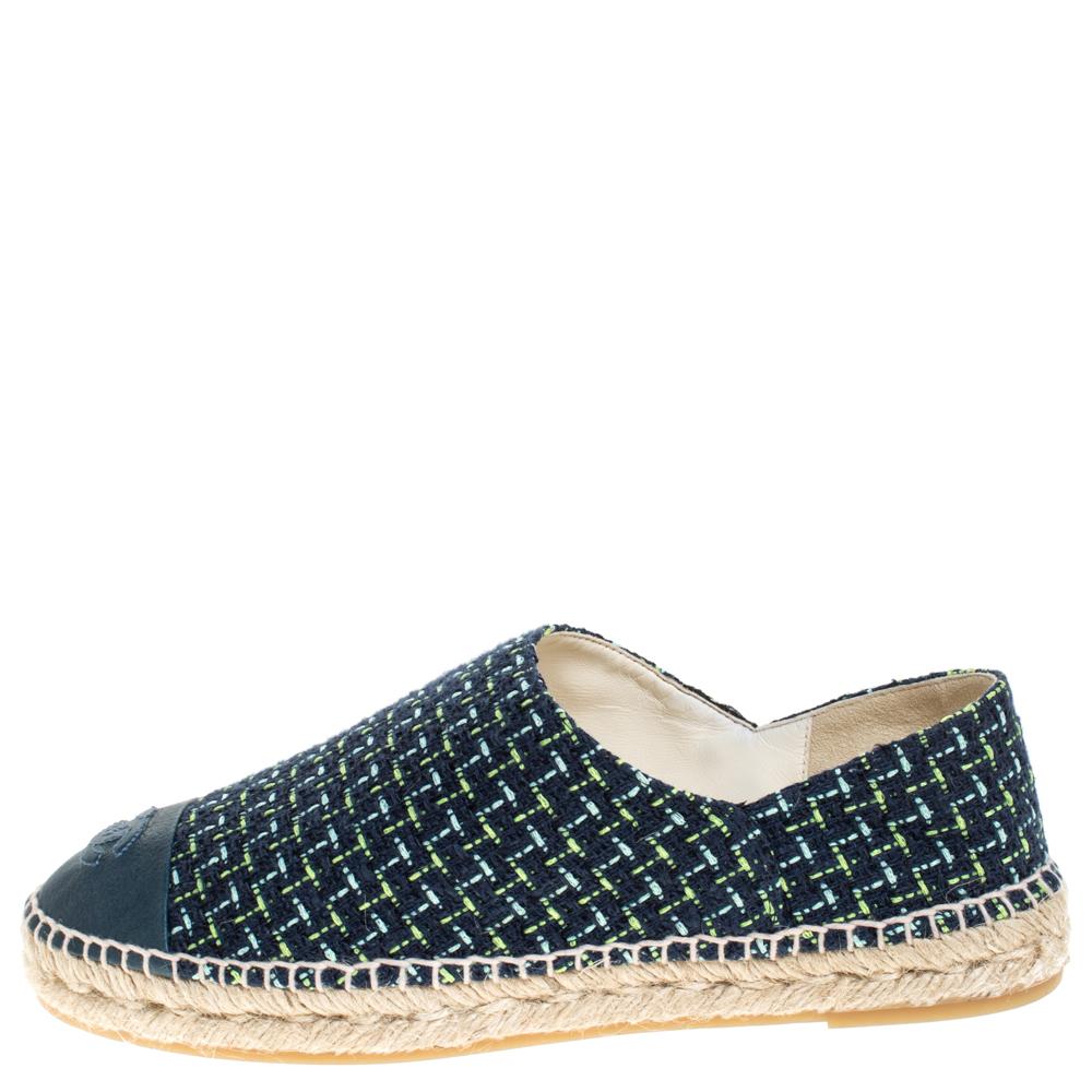 Espadrilles are not just stylish, but also comfortable and easy to wear. This lovely pair from Chanel will accompany a casual outfit with perfection. They are made of tweed fabric and designed with leather cap toe carrying the brand logo and rubber