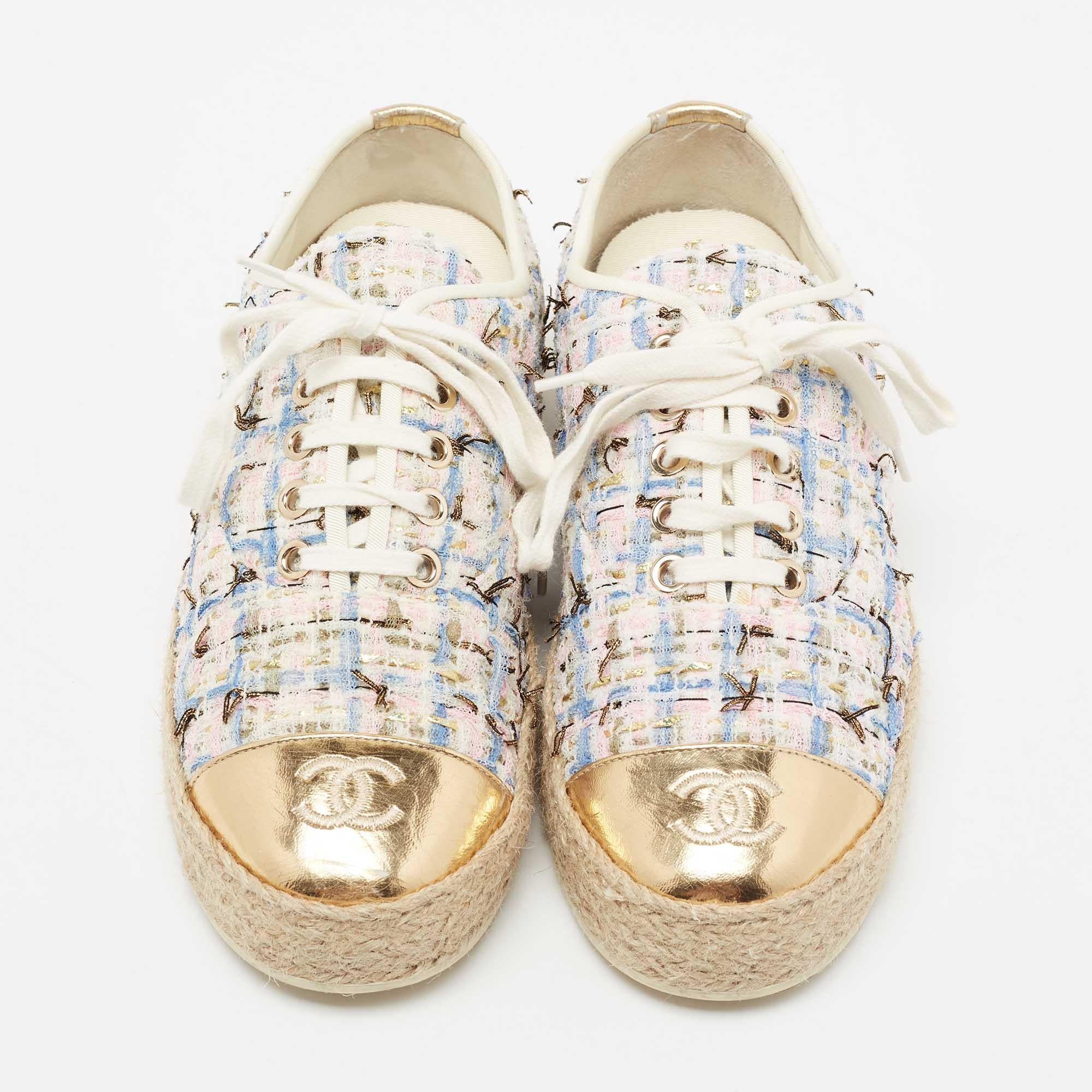 Step out in style with these chic espadrille sneakers from Chanel! These multicolored shoes feature a tweed & foil leather exterior with CC-detailed cap toes, lace-ups, espadrille platforms, and durable rubber soles that offer a comfortable