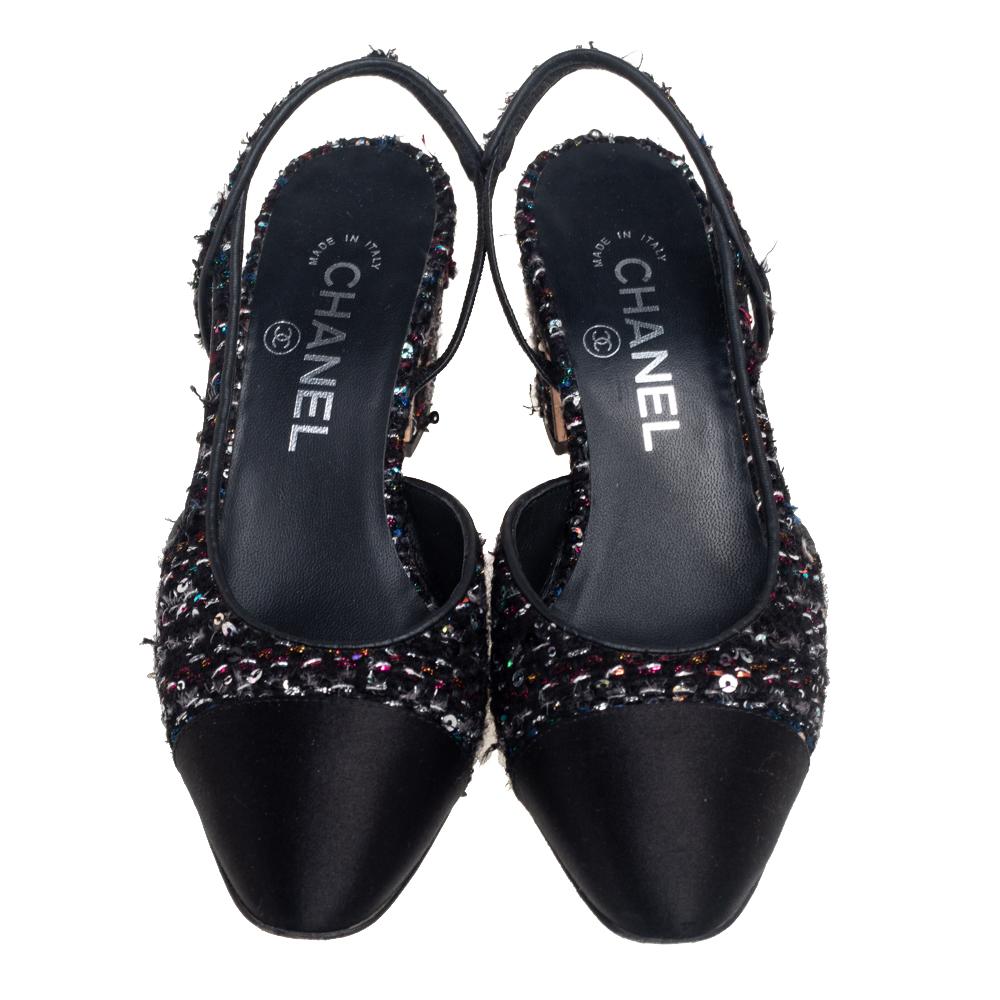 Crafted skillfully with minute attention to detail, these pumps from Chanel justify the iconic prowess and aesthetic of the brand. Their exterior is covered with tweed and satin with a cap-toe and slingback completing their shape. They are mounted