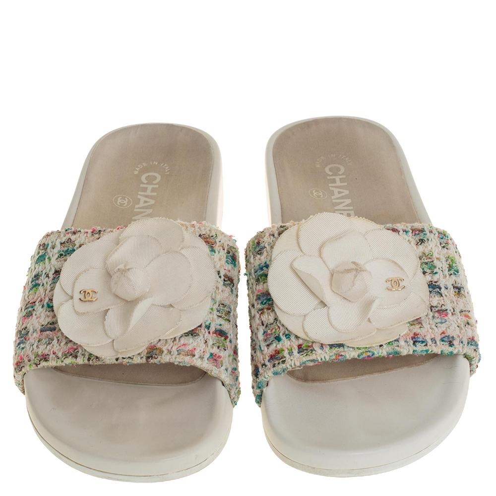 Wear these slides on days when you cannot choose between fashion and comfort for they bring both. They are from Chanel, designed with fabric insoles and front tweed straps embellished with the brand's signature Camellia flower.

