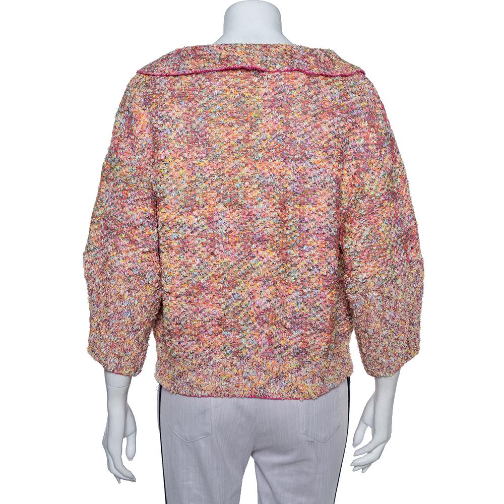 This Chanel multicolored jacket is a versatile piece that goes well with both your formal and evening ensembles. It features sequin embellishments along with CC-detailed pearl buttons and long sleeves. The jacket is super feminine and will add a