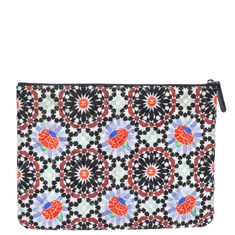 This clutch from Chanel will surely add glam to your style. Designed in multiple hues, this clutch is crafted from fabric and features the signature quilts throughout. This sleek piece is handy and comes with a leather-lined interior that is secured