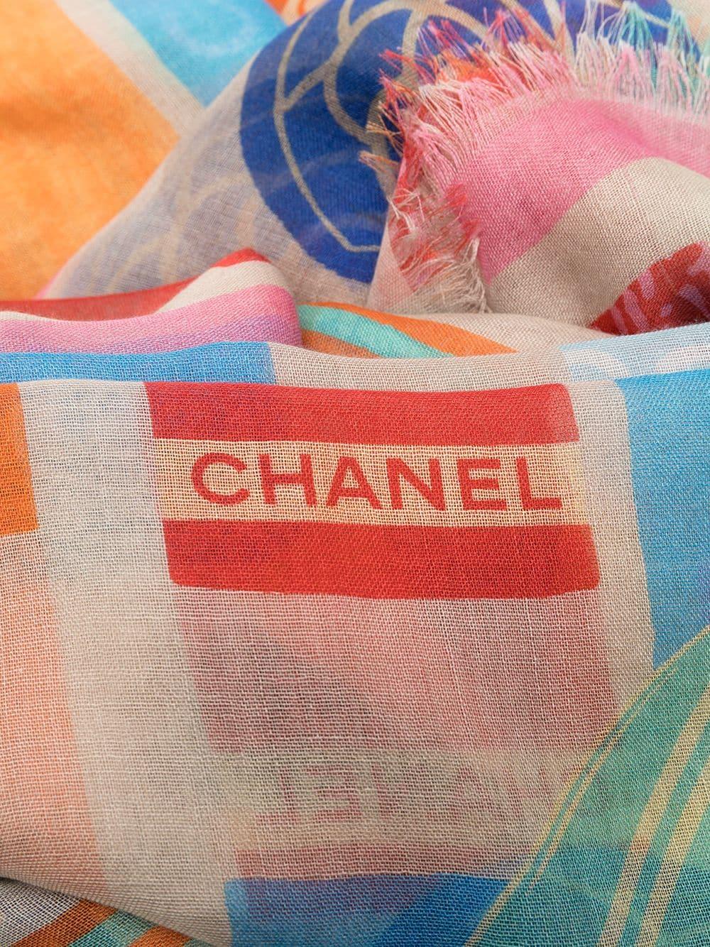 This Chanel scarf is reminiscent of summer holidays at the beach, with Camellia flowers and rectangular pops of colour. Composed of cashmere and silk with a fringed edge makes this scarf easy-to-wear all year round.

Colour: Multi

Measurements: