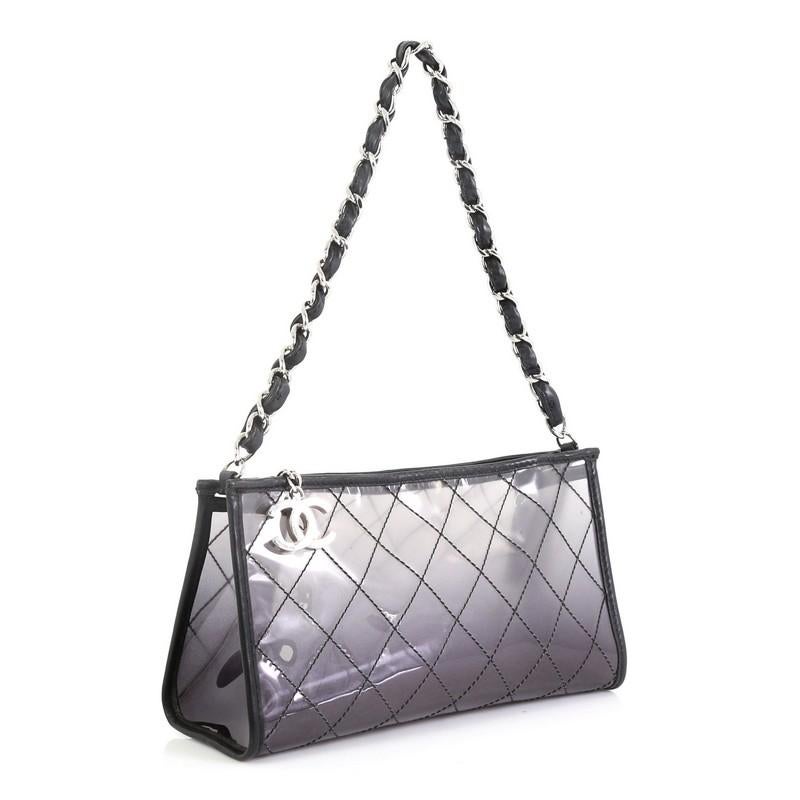 This Chanel Naked Chain Pochette Quilted PVC, crafted in gray quilted PVC, features woven in leather chain link handle and silver-tone hardware. Its zip closure opens to a gray PVC interior. Hologram sticker reads: 11902151. 

Estimated Retail