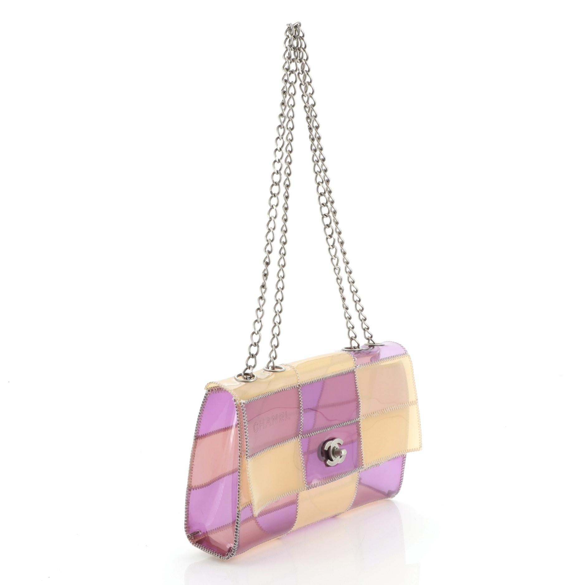 This Chanel Naked Patchwork Flap Bag PVC Medium, crafted in multicolor PVC, features a chain link shoulder strap, frontal flap and silver-tone hardware. Its CC turn-lock closure opens to a multicolor PVC interior. Hologram sticker reads: 5801531.