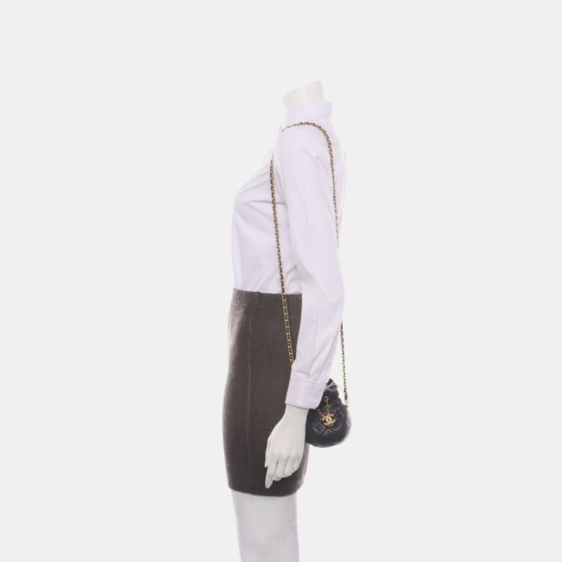 Chanel Nano Bucket Round Clutch Black Lambskin Gold HW Sling Bag
 These are professional photos of the actual bag.
 CONDITION: LIKE NEW
 DETAILS:
 
 
 
 
 
 Post 2021
 Micro-chip
 
 Lambskin leather 
 Black
 Gold tone hardware
 Size: super mini

