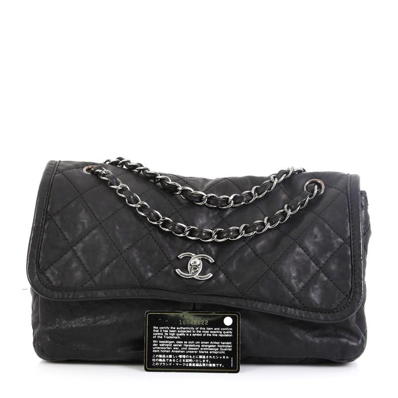This Chanel Natural Beauty Split Pocket Flap Bag Quilted Leather Medium, crafted in black quilted leather, features Chanel's signature diamond quilting design, exterior back pocket, woven-in leather silver chain strap and silver-tone hardware. It