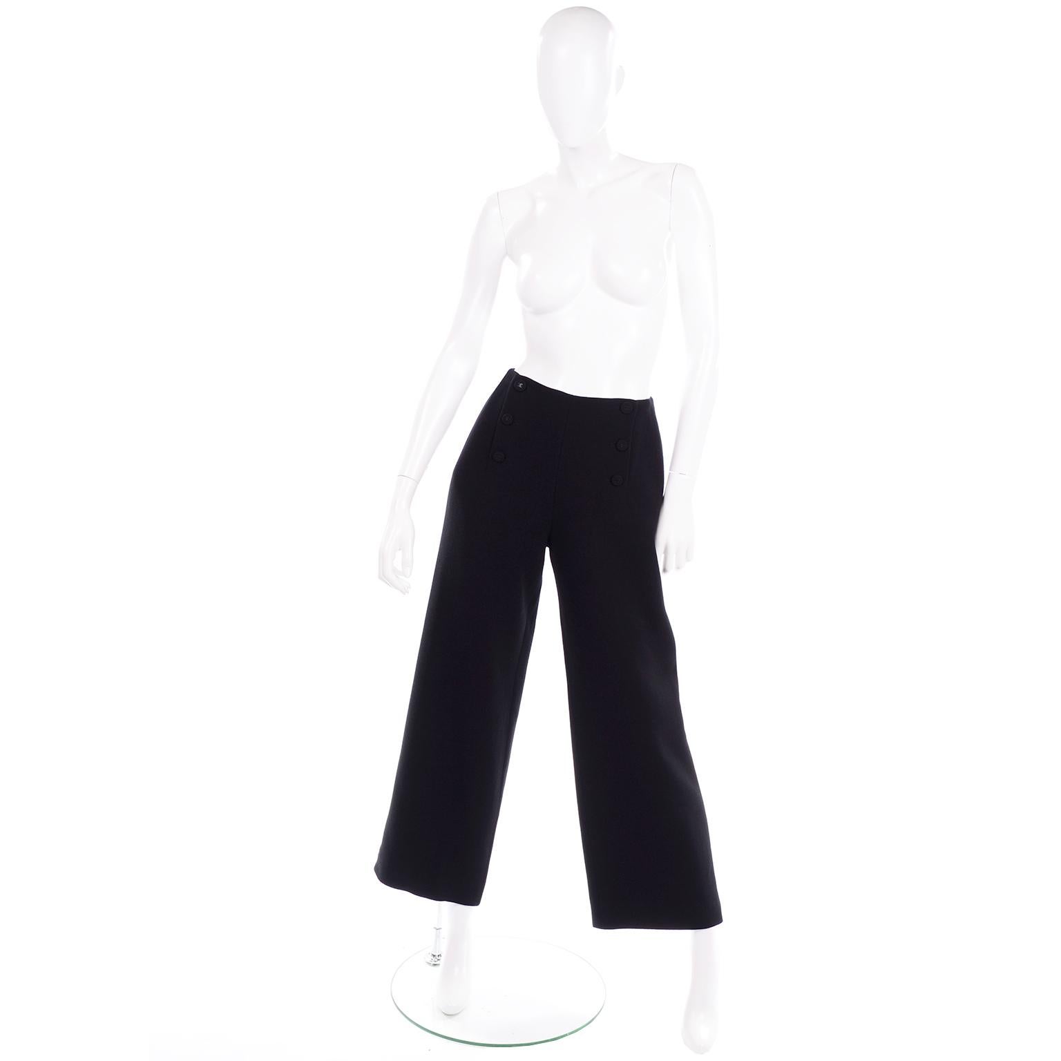 We love these Chanel Pants! These gorgeous Chanel pants are styled like vintage 1940's sailor pants with rows of cc monogram logo buttons on the front, a high waist and wide legs. The pants are 100% wool with beautiful silk lining.  They are in