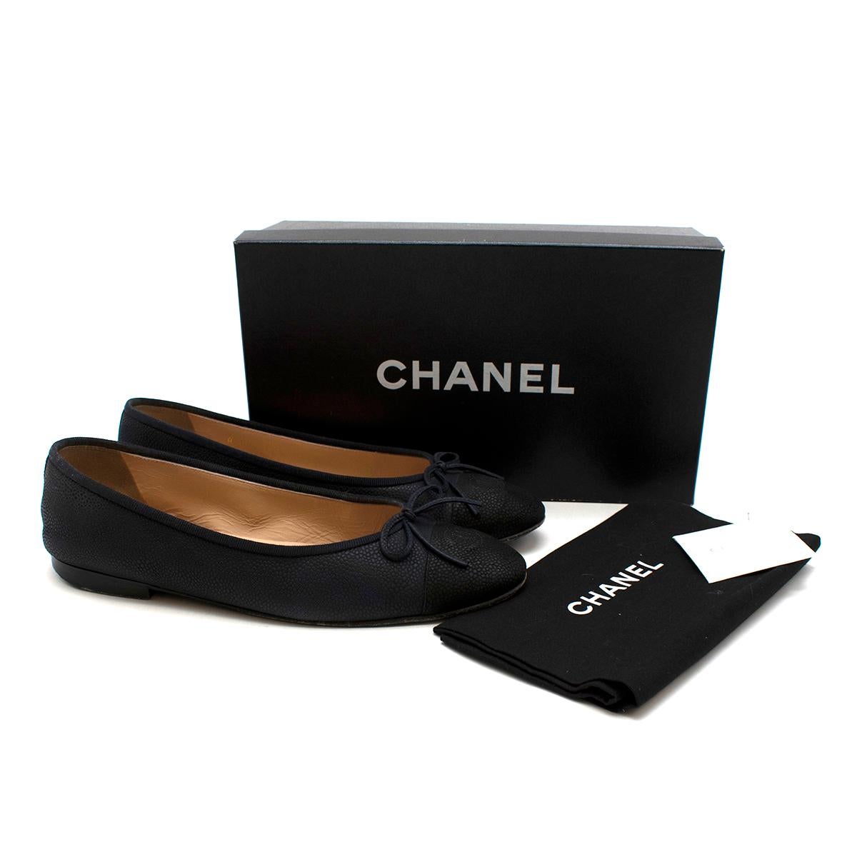 Chanel Black Caviar Leather Ballerina Flats 

- Made of textured caviar leather 
- Neutral blue and black hues 
- Classic style 
- Legendary CC logo details to the toes 
- Original box and dust bag 
- Bow detail to the heels 
- Elegant comfortable